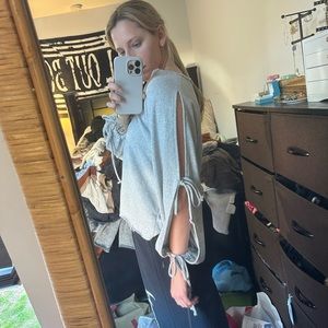 Pull & bear V neck sweater. Sleeves are cut out with ties. Worn a few times
